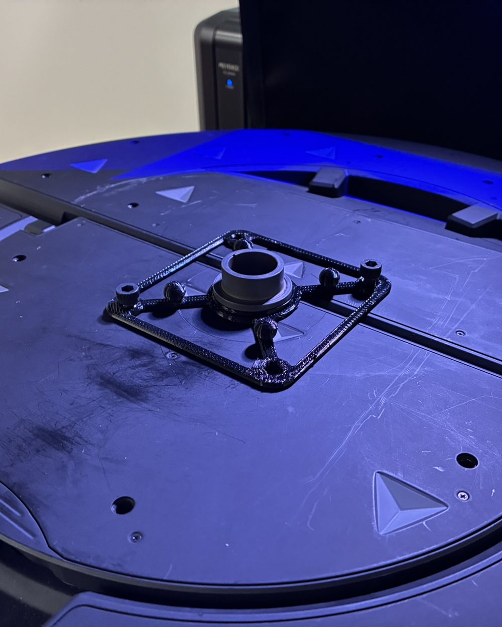 A 3D-printed fixture on the 3D scanner's turntable